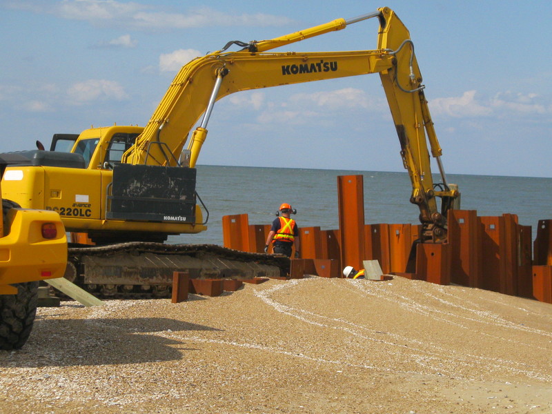 Workers from U.S. Army Corps of Engineers subcontractor Channell Construction are still putting extensions on the Rehoboth Avenue stormwater outfall pipe. Corps officials say the project, which will also extend pipes at Laurel Street and Delaware Avenue, will not be finished by Memorial Day weekend. BY RYAN MAVITY